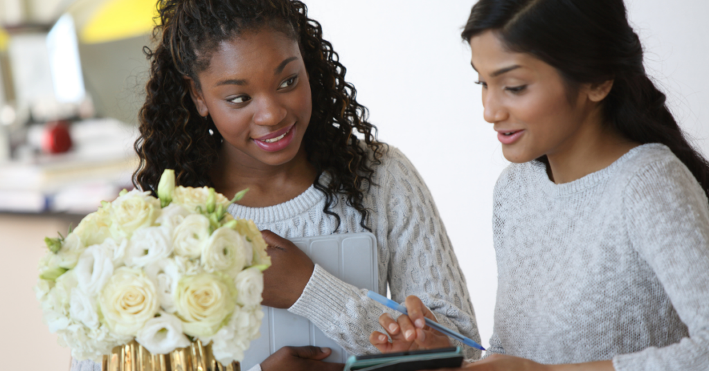 Wedding Planner working with Bride on floral arrangements